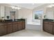 This luxurious main bathroom features a marble shower, separate tub, and dual vanity at 3652 Terrah Point Dr, Duluth, GA 30097