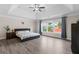 A spacious main bedroom boasts a tray ceiling and large windows, filling the room with natural light at 3652 Terrah Point Dr, Duluth, GA 30097