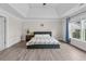A spacious main bedroom boasts a tray ceiling and large windows, filling the room with natural light at 3652 Terrah Point Dr, Duluth, GA 30097