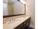 Bathroom features double sinks, a large framed mirror, and shaker cabinets at 4000 Chastain Preserve Ne Way, Atlanta, GA 30342