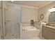 Bathroom featuring separate tub and shower, and granite countertop at 4000 Chastain Preserve Ne Way, Atlanta, GA 30342