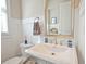 Clean bathroom featuring modern fixtures, wall paneling and white ceramic sink at 4000 Chastain Preserve Ne Way, Atlanta, GA 30342
