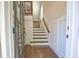 Foyer with hardwood floors and wainscoting leads to the staircase at 4000 Chastain Preserve Ne Way, Atlanta, GA 30342