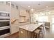Stylish kitchen featuring granite countertops, a center island with seating, and stainless steel appliances at 4000 Chastain Preserve Ne Way, Atlanta, GA 30342