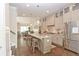 Bright open kitchen with stainless steel appliances and granite countertop island with seating at 4000 Chastain Preserve Ne Way, Atlanta, GA 30342