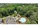 Breathtaking aerial view of the community featuring lush greenery, a pool, and a walking path at 408 Townly Ct, Alpharetta, GA 30009