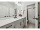 Beautiful bathroom featuring double vanity, modern fixtures, and an open doorway leading to the shower and tub at 408 Townly Ct, Alpharetta, GA 30009