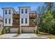 Charming townhomes with private balconies, garages, and manicured landscaping at 408 Townly Ct, Alpharetta, GA 30009