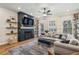 Living room features a fireplace, hardwood floors, and a comfortable sofa with decorative pillows at 408 Townly Ct, Alpharetta, GA 30009