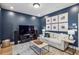 Comfortable living room with dark blue walls, neutral sofa, modern decor, and ample natural light at 408 Townly Ct, Alpharetta, GA 30009