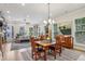 The living room features a fireplace, hardwood floors, and an adjacent dining area and kitchen at 408 Townly Ct, Alpharetta, GA 30009