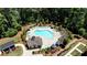 Aerial view of community pool with lounge chairs, umbrellas, and a pergola at 408 Townly Ct, Alpharetta, GA 30009