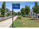 Picturesque street view of the community, featuring lush landscaping and well-appointed homes at 408 Townly Ct, Alpharetta, GA 30009