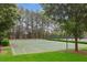 Outdoor basketball court surrounded by lush greenery, perfect for recreational activities at 147 Longleaf Dr, Canton, GA 30114