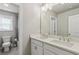 This bathroom features a double vanity with a large mirror and a combination shower and tub at 147 Longleaf Dr, Canton, GA 30114