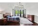 This spacious bedroom has a tray ceiling, hardwood floors and a large window for lots of natural light at 147 Longleaf Dr, Canton, GA 30114