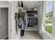 This well-organized closet with lots of shelving has a convenient window for natural light and organization at 147 Longleaf Dr, Canton, GA 30114
