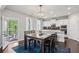 Modern dining room with stylish lighting fixture and view to covered patio at 147 Longleaf Dr, Canton, GA 30114