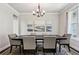 Bright dining room featuring hardwood floors, a modern chandelier, and stylish decor, creating a welcoming space at 147 Longleaf Dr, Canton, GA 30114