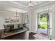 Formal dining room with hardwood floors, decorative lighting, and elegant decor perfect for entertaining guests at 147 Longleaf Dr, Canton, GA 30114