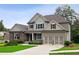 Charming two-story home featuring a well-manicured lawn, neutral siding, stone accents and a two-car garage at 147 Longleaf Dr, Canton, GA 30114