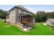 This home showcases an expansive lawn and screened-in porch, blending indoor/outdoor living at 147 Longleaf Dr, Canton, GA 30114
