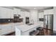Spacious kitchen features white cabinets, granite countertops, and stainless steel appliances at 147 Longleaf Dr, Canton, GA 30114