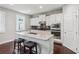 Modern kitchen with granite counters, stainless appliances and island with seating at 147 Longleaf Dr, Canton, GA 30114