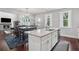 Kitchen with stainless appliances, an island with seating, and view to the dining area at 147 Longleaf Dr, Canton, GA 30114