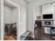 View of the laundry room showing the washer and dryer and view to the living room fireplace at 147 Longleaf Dr, Canton, GA 30114