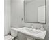 Clean powder room featuring a pedestal sink and neutral walls, perfect for guests at 147 Longleaf Dr, Canton, GA 30114