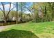 An expansive backyard with mature trees, perfect for outdoor activities at 1521 Sylvan Sw Rd, Atlanta, GA 30310