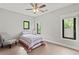 Cozy bedroom offering neutral tones, hardwood flooring, and lots of natural light at 1521 Sylvan Sw Rd, Atlanta, GA 30310