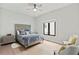 Comfortable bedroom showcasing decorative headboard, side tables, and neutral color palette at 1521 Sylvan Sw Rd, Atlanta, GA 30310
