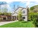 Charming two-story home features a welcoming front porch and a lush green lawn at 1521 Sylvan Sw Rd, Atlanta, GA 30310