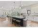 Bright and airy kitchen with granite countertops, pendant lighting, and open to the dining and living areas at 1521 Sylvan Sw Rd, Atlanta, GA 30310