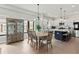 Bright, modern kitchen with stainless steel appliances, a central island, and an adjacent dining area at 1521 Sylvan Sw Rd, Atlanta, GA 30310