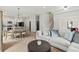 Open-concept living room features a seamless flow to the kitchen and natural light, ideal for modern living at 1521 Sylvan Sw Rd, Atlanta, GA 30310