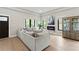 Bright living room featuring a comfortable sofa, stylish decor, an electric fireplace, and hardwood floors at 1521 Sylvan Sw Rd, Atlanta, GA 30310