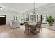 Spacious open-concept layout with abundant natural light showcases dining and living areas with hardwood floors at 1521 Sylvan Sw Rd, Atlanta, GA 30310