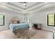 Tranquil main bedroom with tray ceilings, natural light and hardwood floors offers a peaceful retreat at 1521 Sylvan Sw Rd, Atlanta, GA 30310