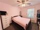 Bedroom with pink walls and brown carpet at 33 Bo Xing, Temple, GA 30179