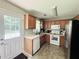Well-equipped kitchen with stainless steel refrigerator and ample cabinet space at 33 Bo Xing, Temple, GA 30179