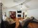 Spacious living room with hardwood floors, a fireplace, and lots of natural light at 33 Bo Xing, Temple, GA 30179