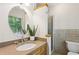 Bathroom featuring a vanity and mirror beside a tiled shower at 5240 Arrie Way, Atlanta, GA 30360