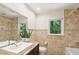 Elegant bathroom with granite countertop and diamond tiled walls at 5240 Arrie Way, Atlanta, GA 30360