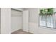 Bright bedroom featuring a closet and window with charming striped curtains at 5240 Arrie Way, Atlanta, GA 30360