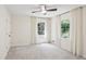 Bright bedroom with neutral walls, soft carpet, and two windows at 5240 Arrie Way, Atlanta, GA 30360