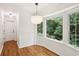 Breakfast nook featuring large bay window with wooded backyard view at 5240 Arrie Way, Atlanta, GA 30360