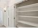 Hallway linen closet with white wood shelving at 5240 Arrie Way, Atlanta, GA 30360
